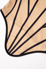 Close-up of the tan fabric with black geometric lines on a corset.