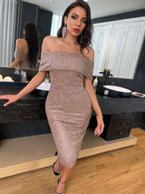 Woman wearing a sparkling beige off-the-shoulder fitted dress