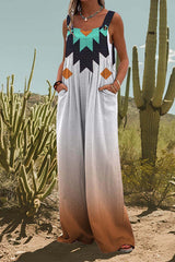 Woman wearing a white jumpsuit with a geometric print and ombre effect, standing in a desert landscape with cacti.