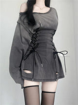Close-up of the gray dress showing the lace-up corset waist and cut-out details.