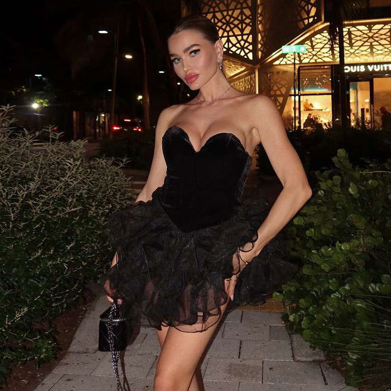 woman wearing a black strapless velvet and tulle dress