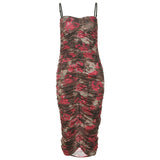 A floral print ruched midi dress with spaghetti straps