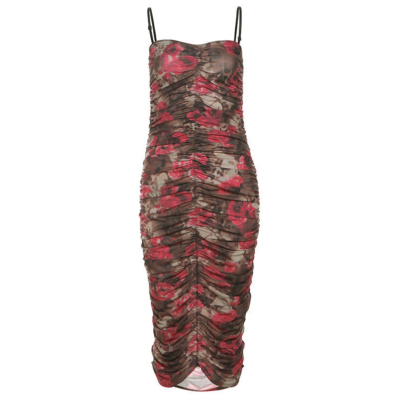 A floral print ruched midi dress with spaghetti straps