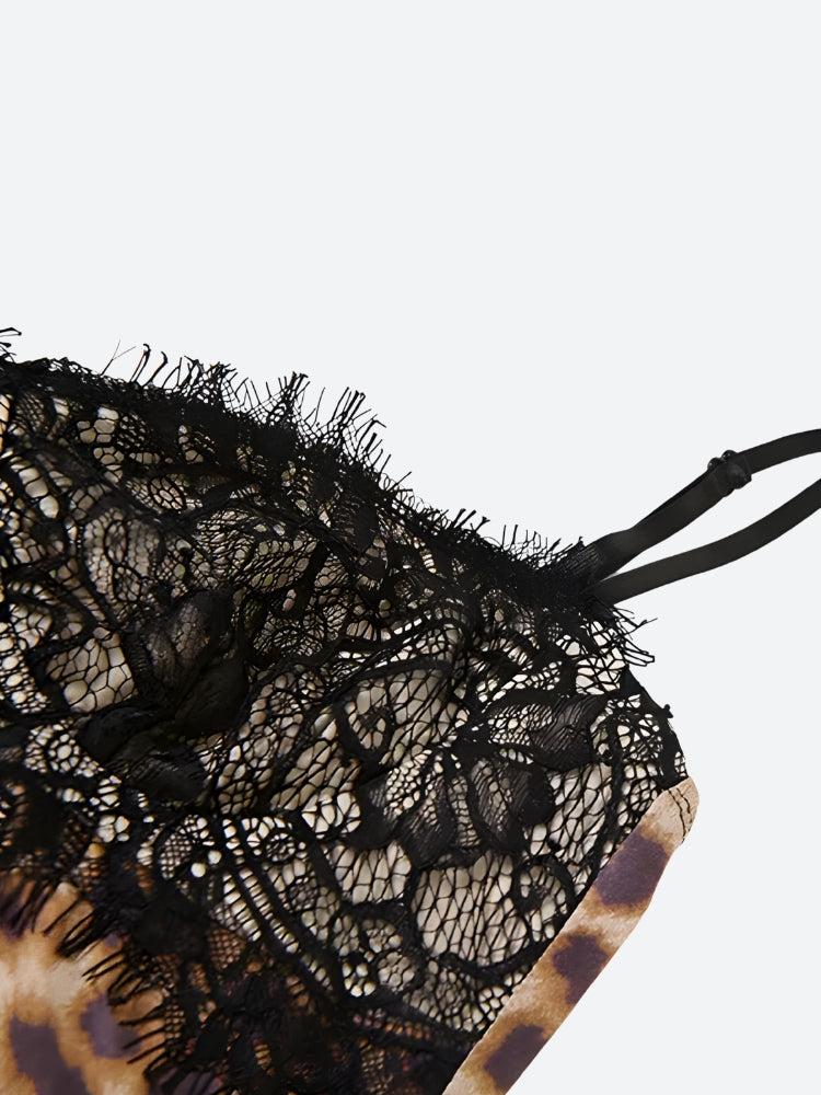 Close-up of the black lace detail on the bust of a slip dress.