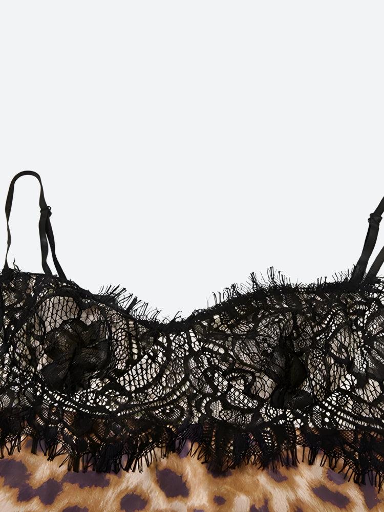 Close-up of the black lace trim on the hem of a slip dress.