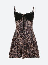 Close-up of a leopard print dress with a black lace sweetheart neckline and tie detail