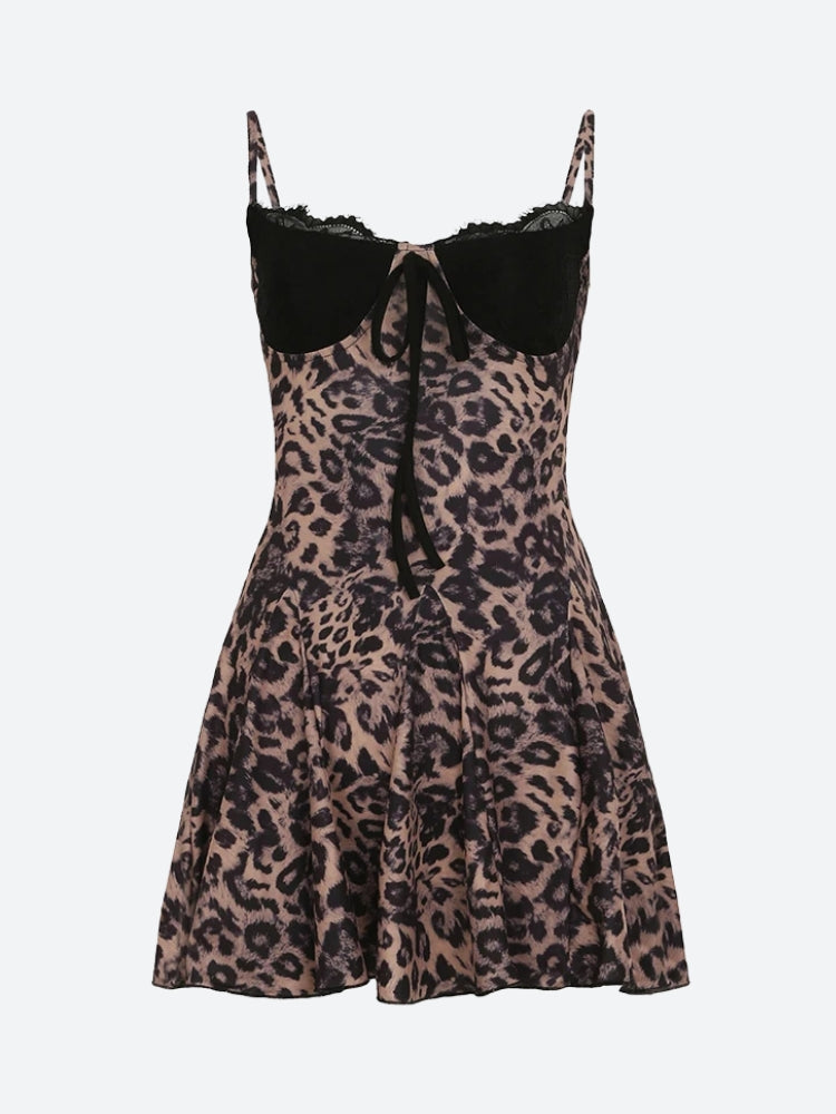 Close-up of a leopard print dress with a black lace sweetheart neckline and tie detail