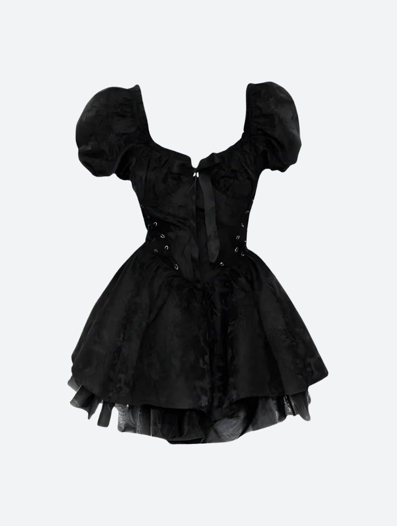 A black off-the-shoulder dress with puff sleeves, corset detailing, and a tiered skirt, displayed on a white background.