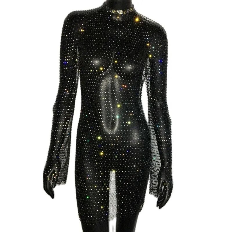 A black full-body jumpsuit covered in colorful rhinestones, with long sleeves and a high neckline.