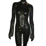 A black full-body jumpsuit covered in colorful rhinestones, with long sleeves and a high neckline.