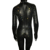The back of a black full-body jumpsuit covered in colorful rhinestones, with long sleeves and a high neckline.