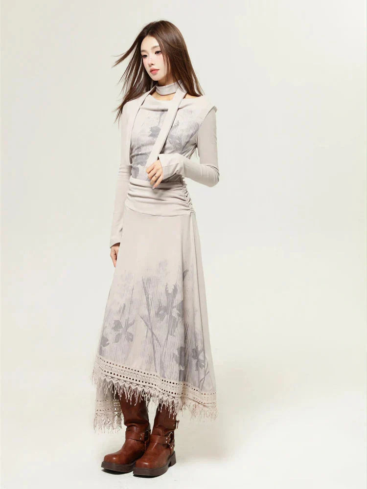 Side view of a woman wearing a beige long-sleeved dress with a floral print and a layered top, paired with brown boots.