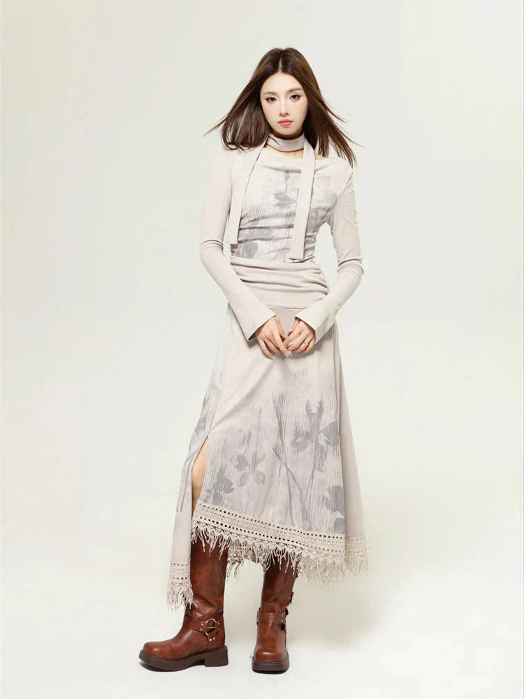 Woman wearing a beige long-sleeved dress with a floral print and a layered top, paired with brown boots.