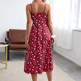Back view of a woman in a red floral print midi dress