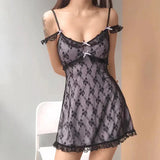 front view of a woman in a black lace babydoll dress with spaghetti straps