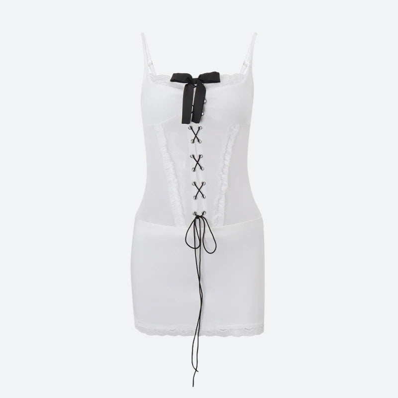 A white corset dress with black lace-up detailing and a black bow, shown against a plain background.