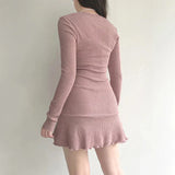 back view of a woman wearing a pink ribbed knit dress