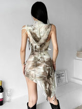 Back view of a woman in a beige and brown tie-dye mini dress with a hooded cowl neck and distressed detailing.