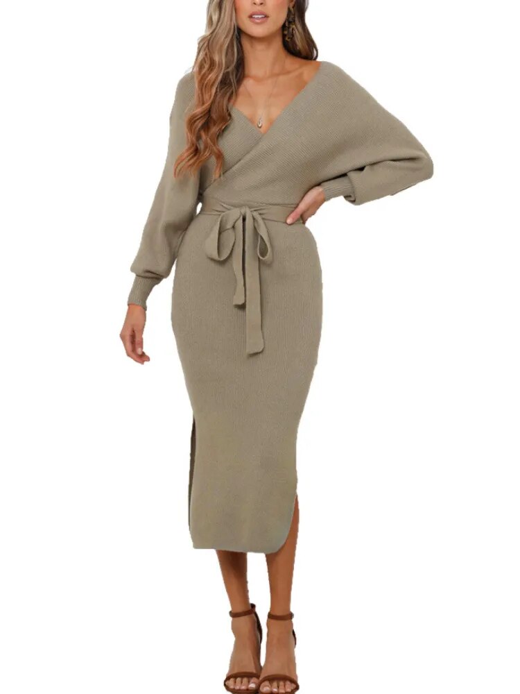 woman wearing a khaki knitted wrap dress with a belted waist and batwing sleeves, paired with brown heels