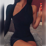 Close-up of a woman in a black one-shoulder mini dress.