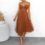woman in a brown midi tulle dress with spaghetti straps and a sweetheart neckline