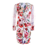 Red floral print dress with sheer sleeves and a plunging v-neck, laid flat.