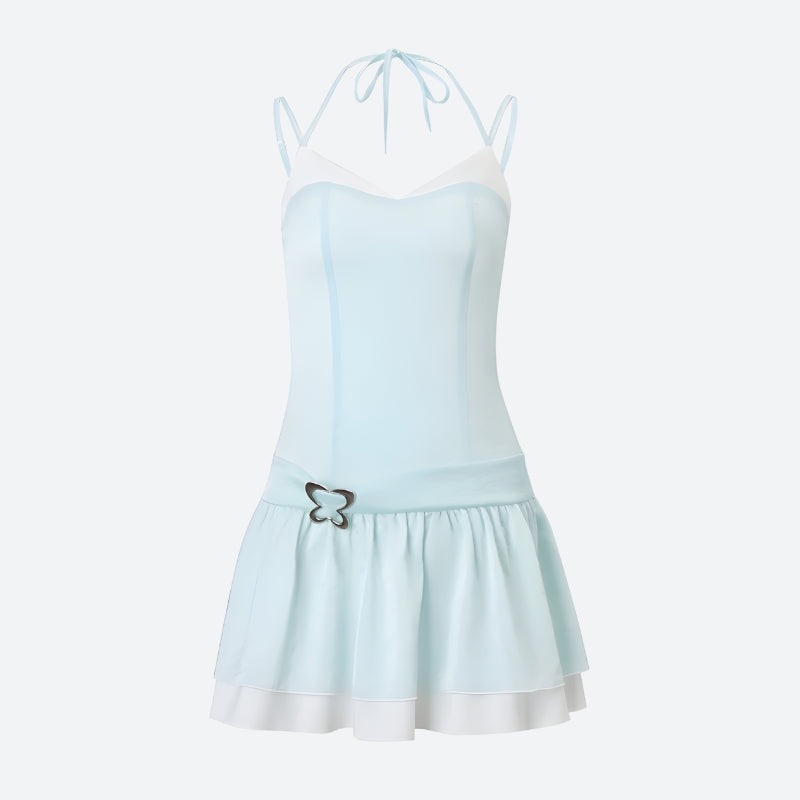 Product image of a light blue and white ruffled dress with a butterfly embellishment and spaghetti straps.