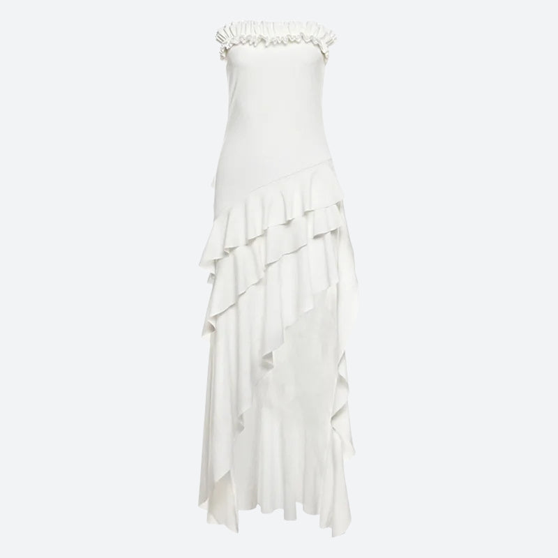 A white strapless ruffled maxi dress with an asymmetrical hem and tiered ruffles on the skirt.