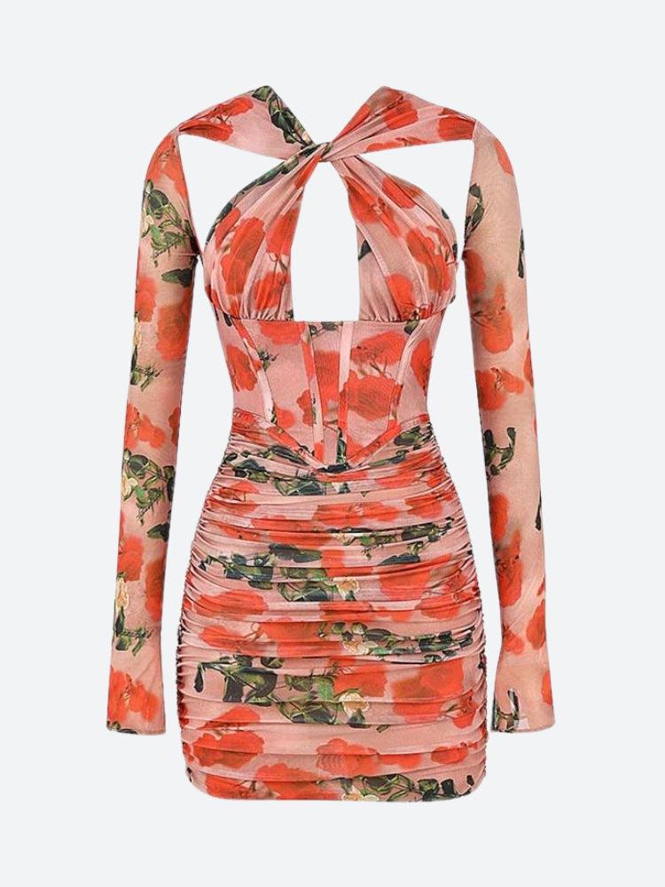 Front view of a pink floral dress with a halter neckline and ruched detailing.
