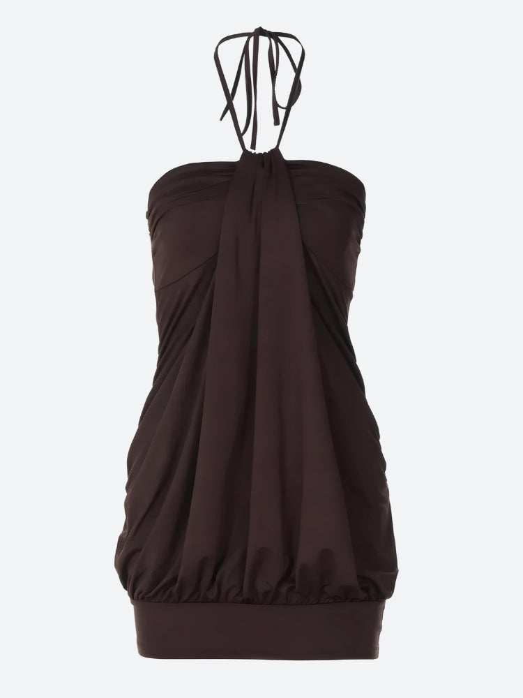 A brown halter dress with ruching and a bubble hem.