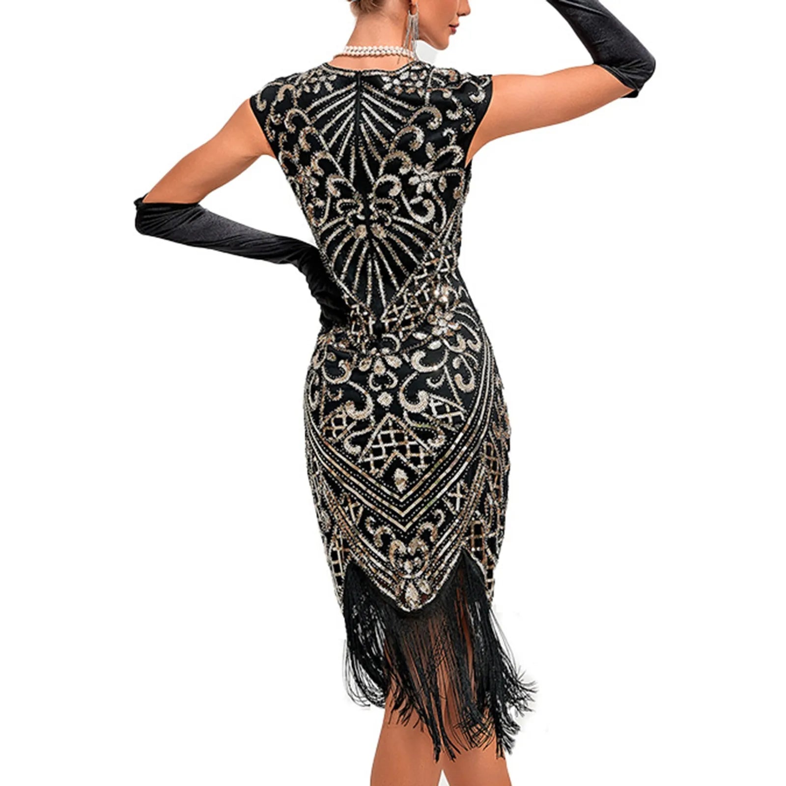 back view of a black and gold sequined flapper dress with fringe and long black gloves