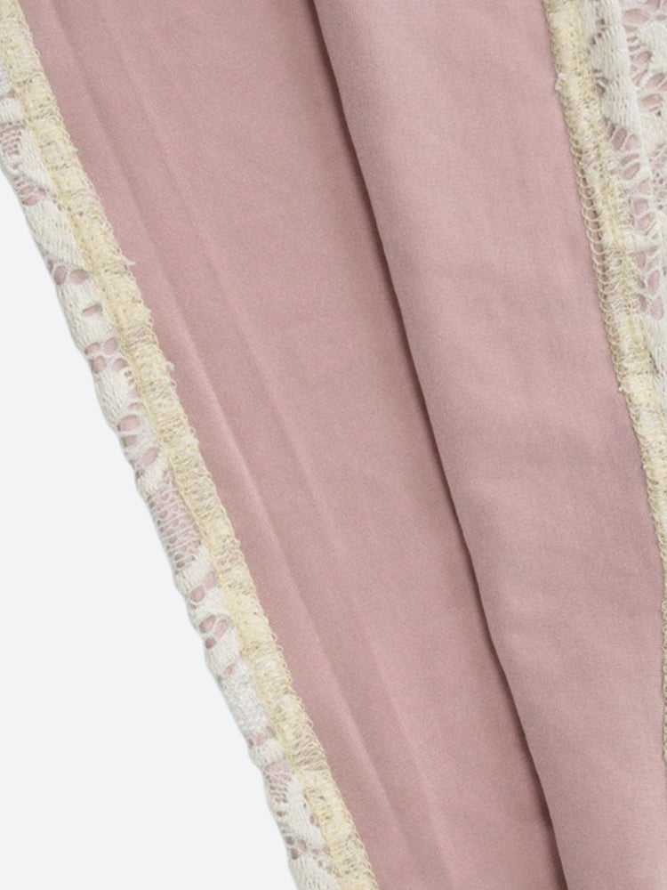 close-up of the lining and lace trim of a white lace dress