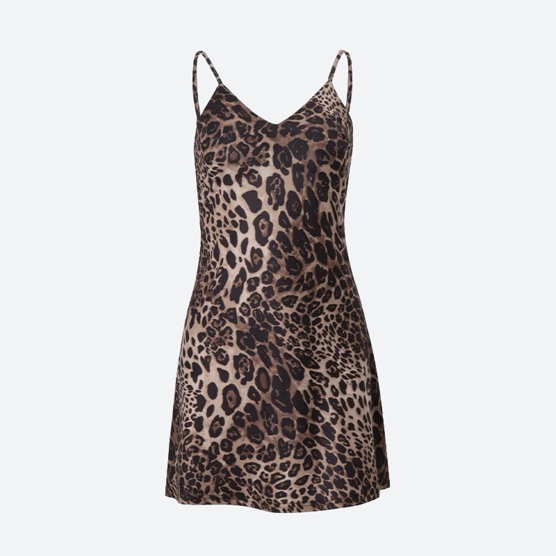 A short leopard print slip dress with spaghetti straps, laid flat.