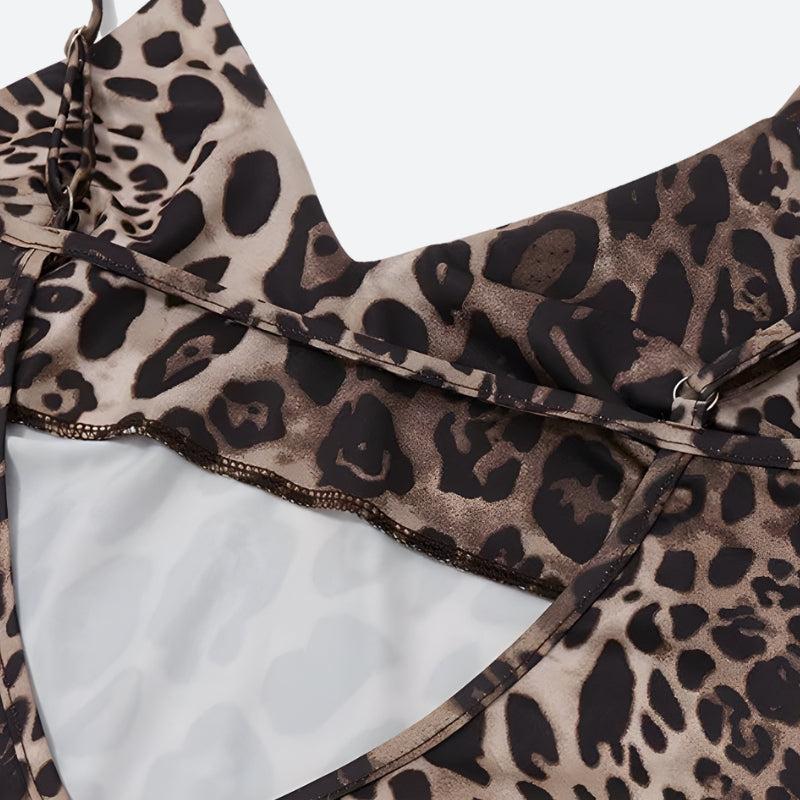Close-up of the open back detail of a leopard print slip dress.
