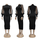 Mannequins displaying a black midi dress with sheer puff sleeves and a mock neck from the front, side, and back.