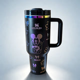 Stanley 40 oz Mickey Mouse insulated tumbler in white with classic Mickey character drawings, gloves, bows, and ergonomic handle - View 2 | Clistos