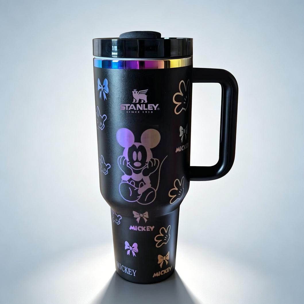 Stanley 40 oz Mickey Mouse insulated tumbler in white with classic Mickey character drawings, gloves, bows, and ergonomic handle - View 2 | Clistos