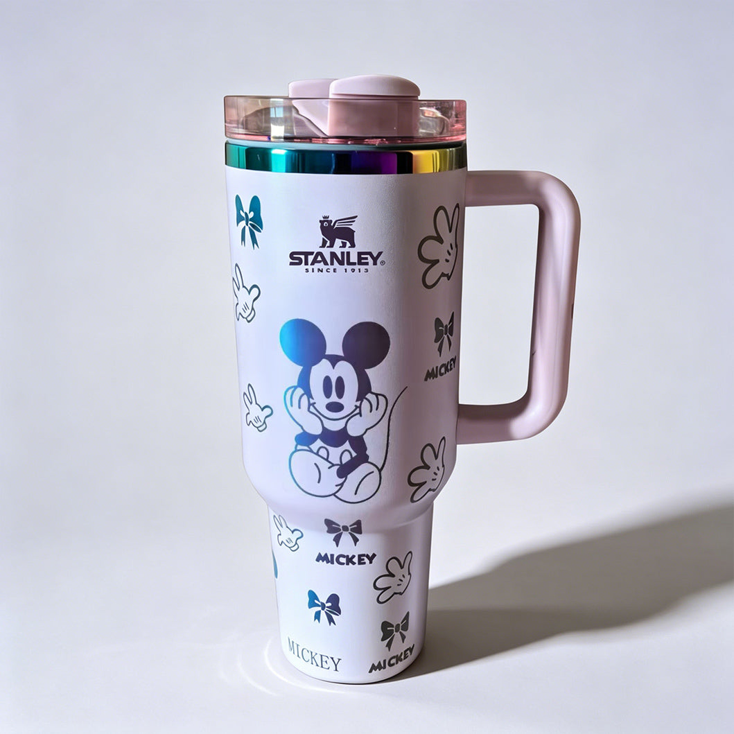 Stanley 40 oz Mickey Mouse insulated tumbler in white with classic Mickey character drawings, gloves, bows, and ergonomic handle - View 3 | Clistos