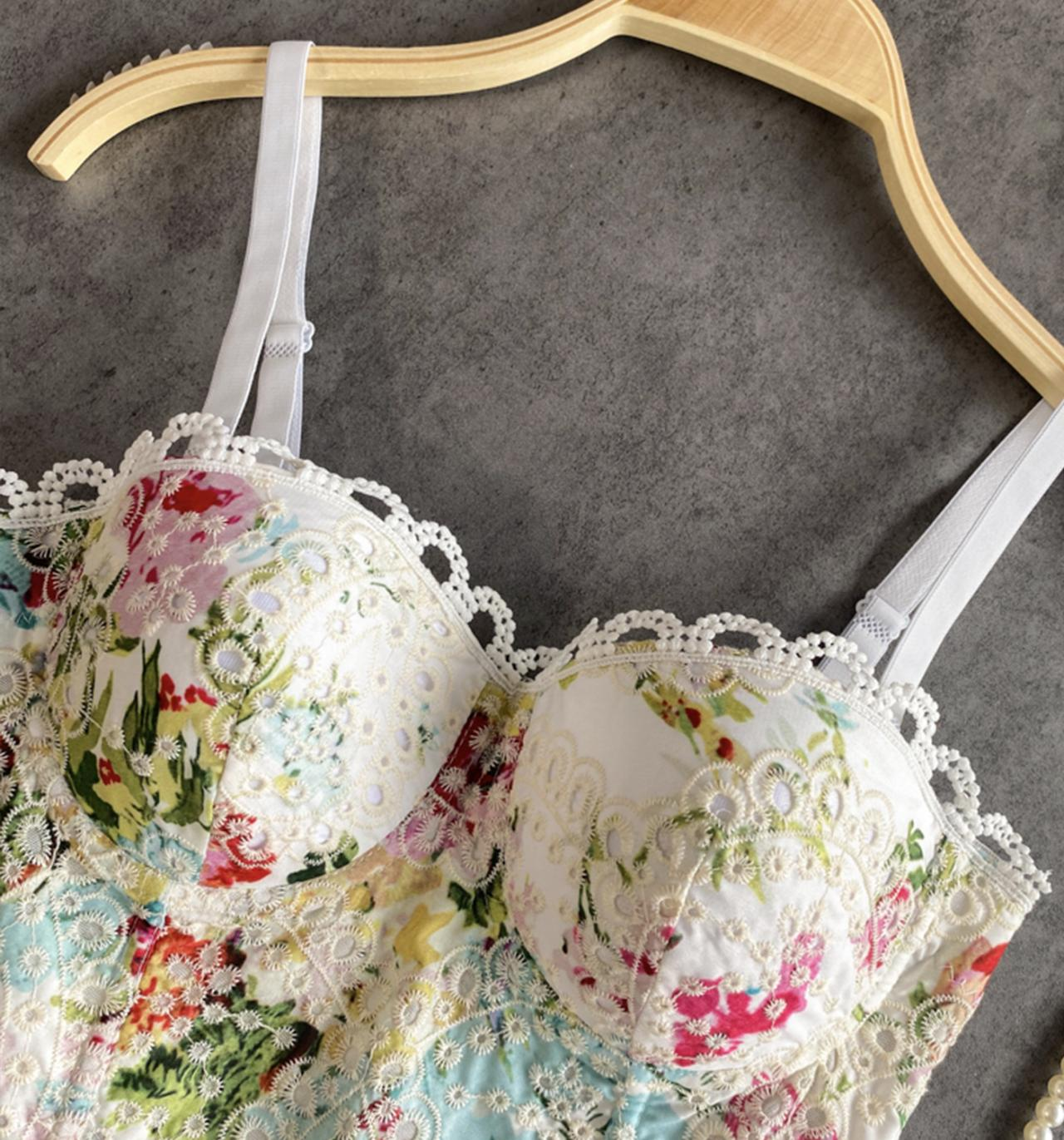 Close-up of the floral print and lace details on the corset top.