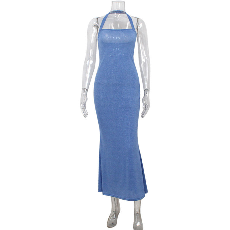 Mannequin wearing a sparkly blue halter neck maxi dress