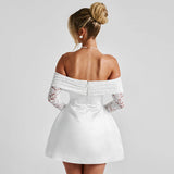 back view of woman in white off-the-shoulder mini dress with lace sleeves