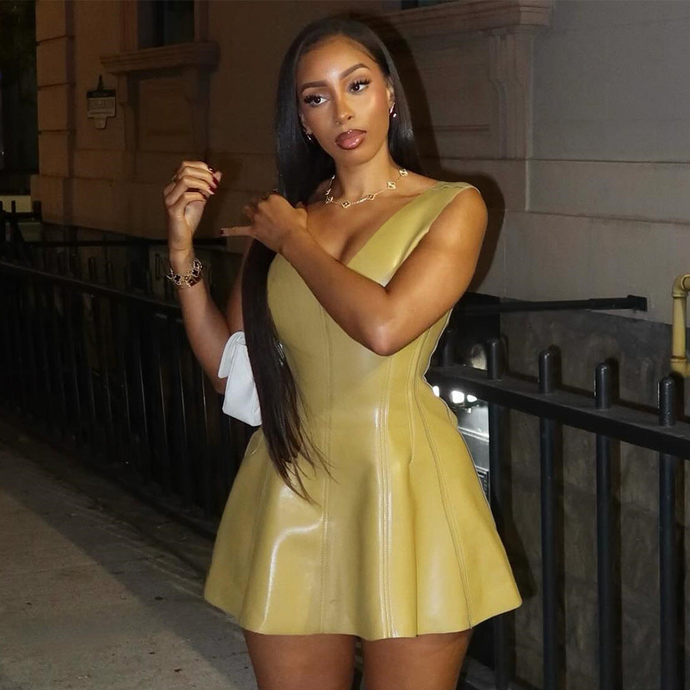 woman in yellow leather-like dress and white boots