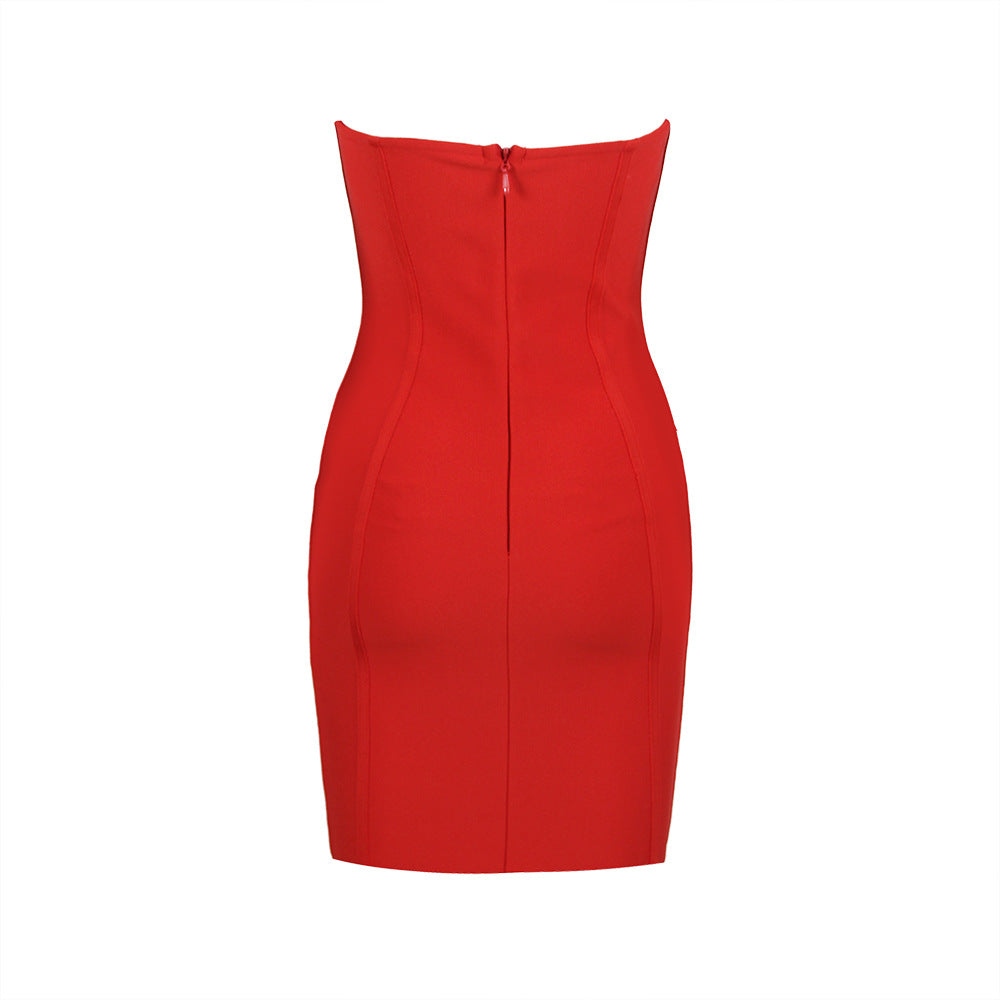 The back of a red strapless bodycon dress with a zipper closure.