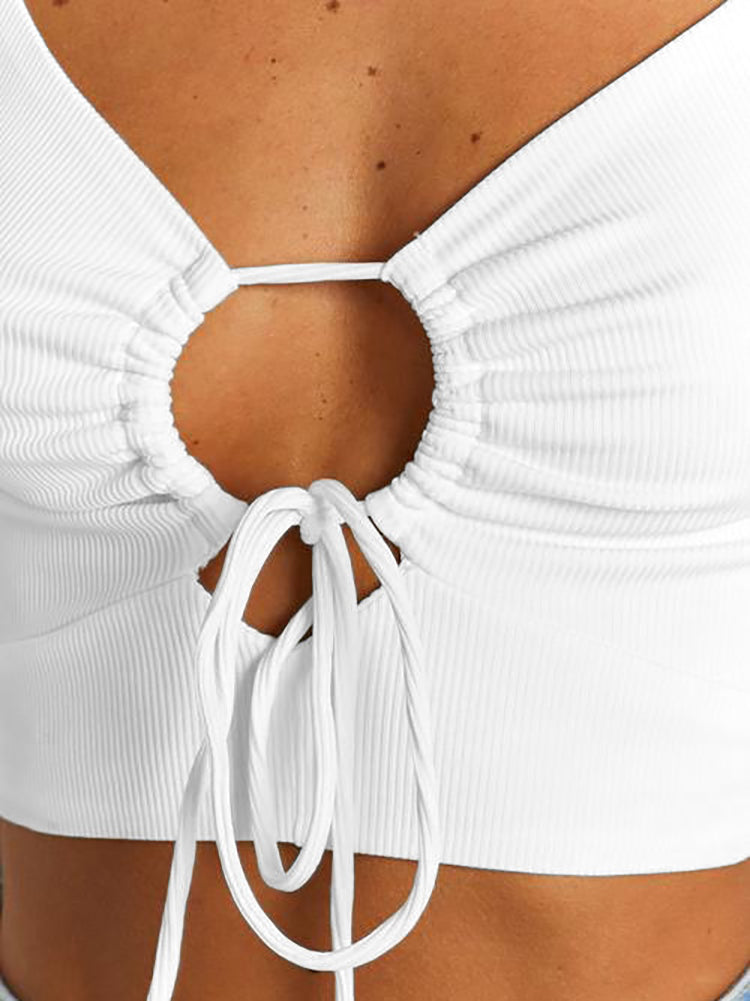 Close-up of the tie detail on a white crop top