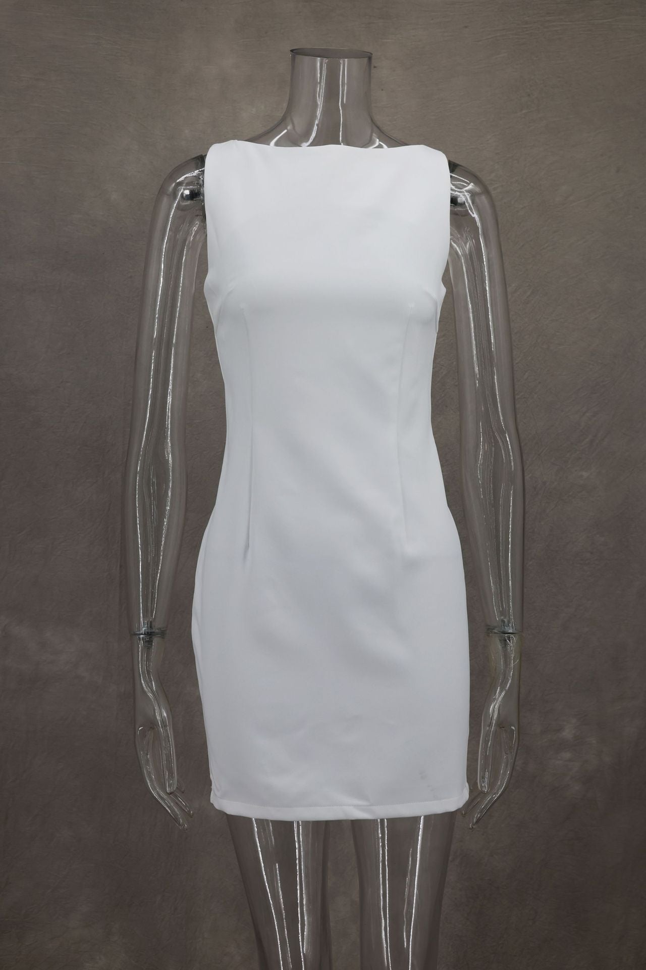 A white sleeveless bodycon mini dress on a mannequin