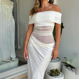 woman in white off-the-shoulder ruched dress with sheer midriff