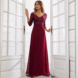 woman in a burgundy sequined dress