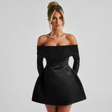 woman in black off-the-shoulder mini dress with lace sleeves
