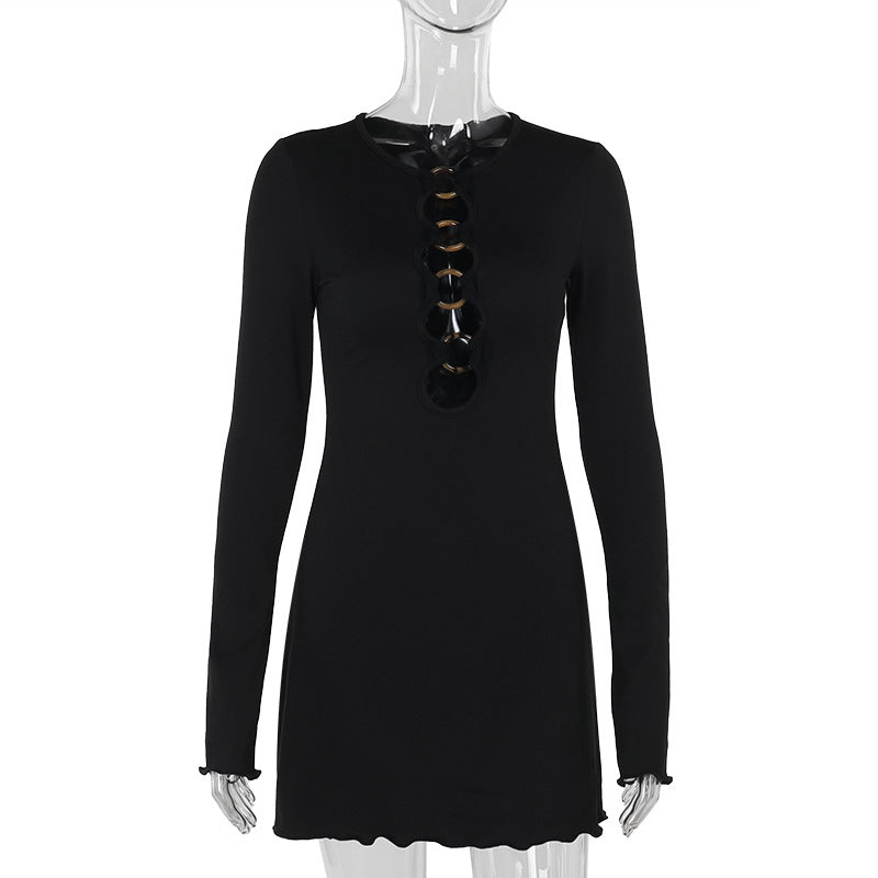 black long-sleeved mini dress with gold ring detail
