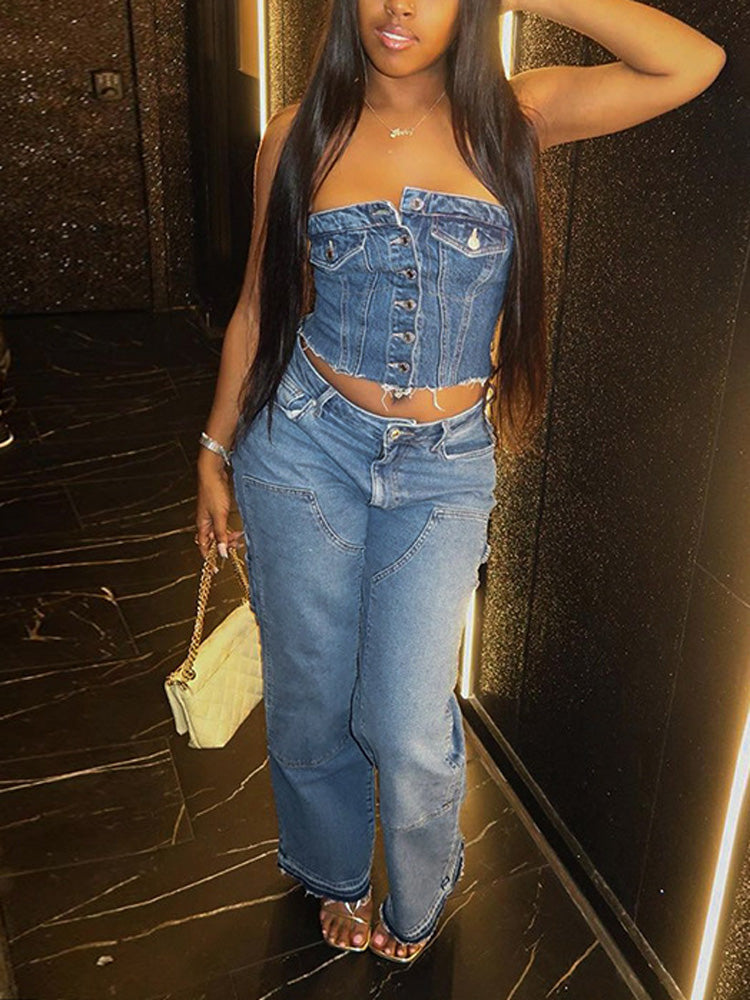A woman wearing a blue denim strapless corset top with matching blue denim pants